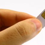 SIM card in the fingers